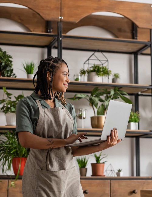 happy-african-american-florist-in-apron-holding-la-2026-03-26-04-36-24-utc
