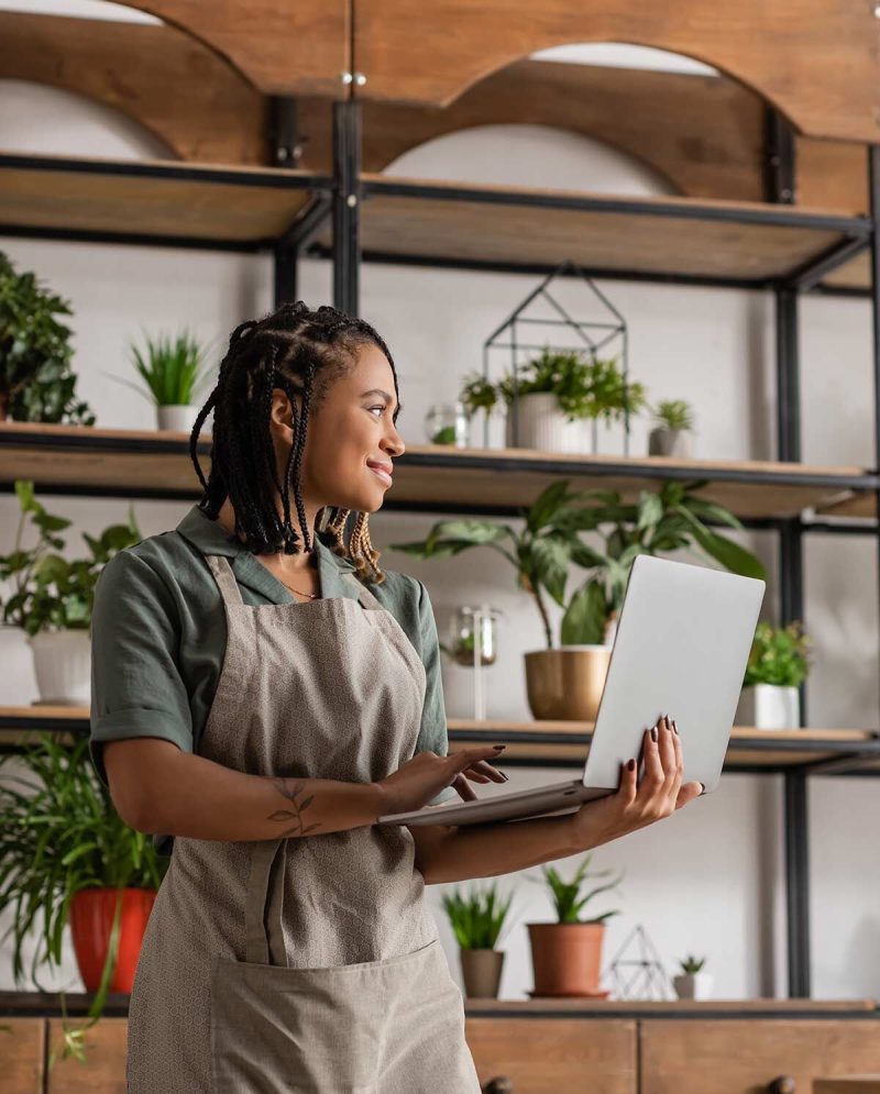 happy-african-american-florist-in-apron-holding-la-2026-03-26-04-36-24-utc