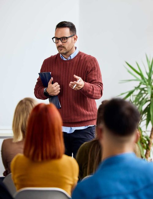 man-presenting-to-audience-in-a-workplace-setting-2026-03-26-23-29-52-utc