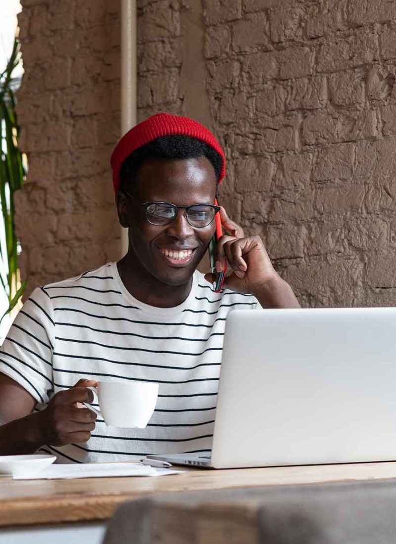 smiling-african-freelancer-man-talking-on-phone-h-2026-01-09-00-38-17-utc